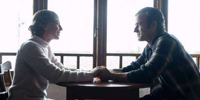 Kevin and Nora holds hands and smile while sitting across from each other in The Leftovers series finale
