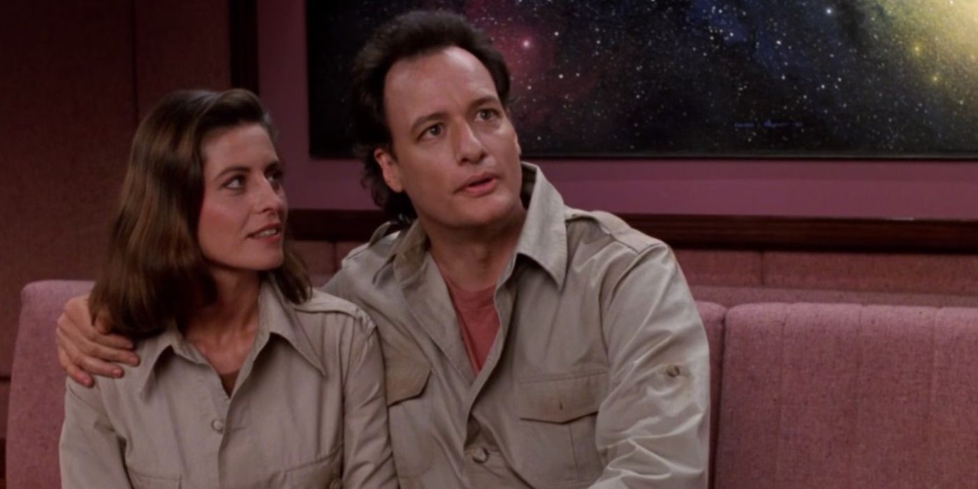 Q puts his arm around Vash in Star Trek TNG