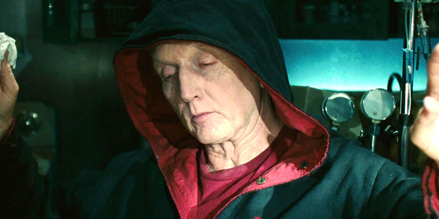 Tobin Bell as Jigsaw wearing a hood