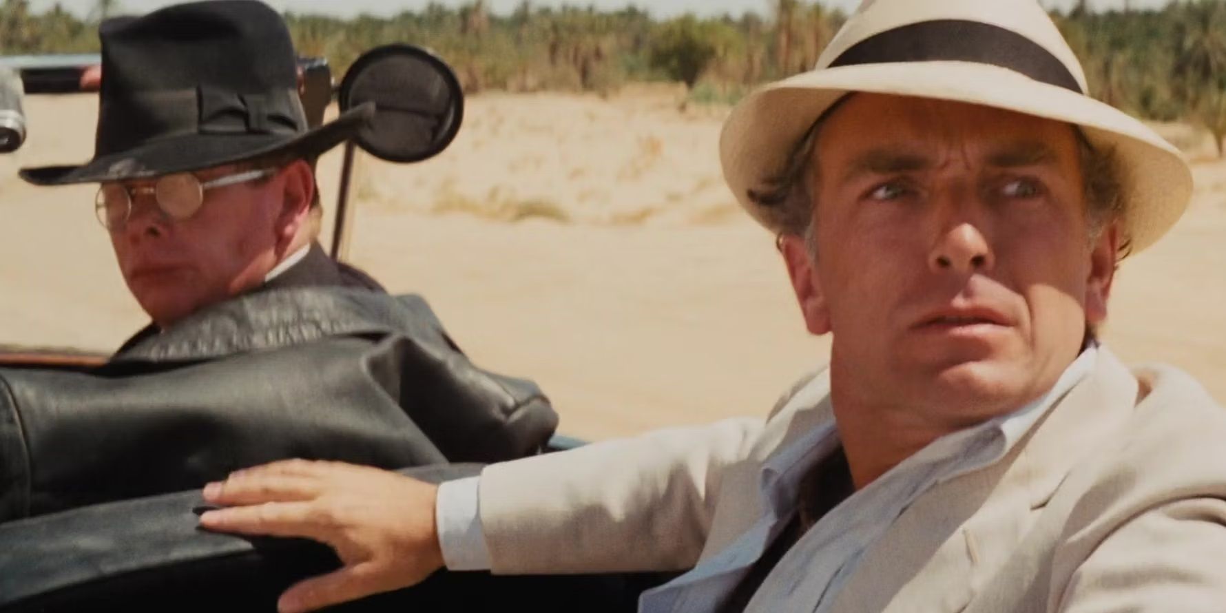 Toht and Belloq in a car in Raiders of the Lost Ark