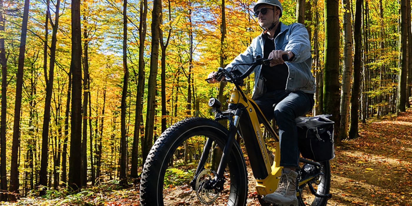 The Magicycle Deer E-Bike SUV is being driven in the forest