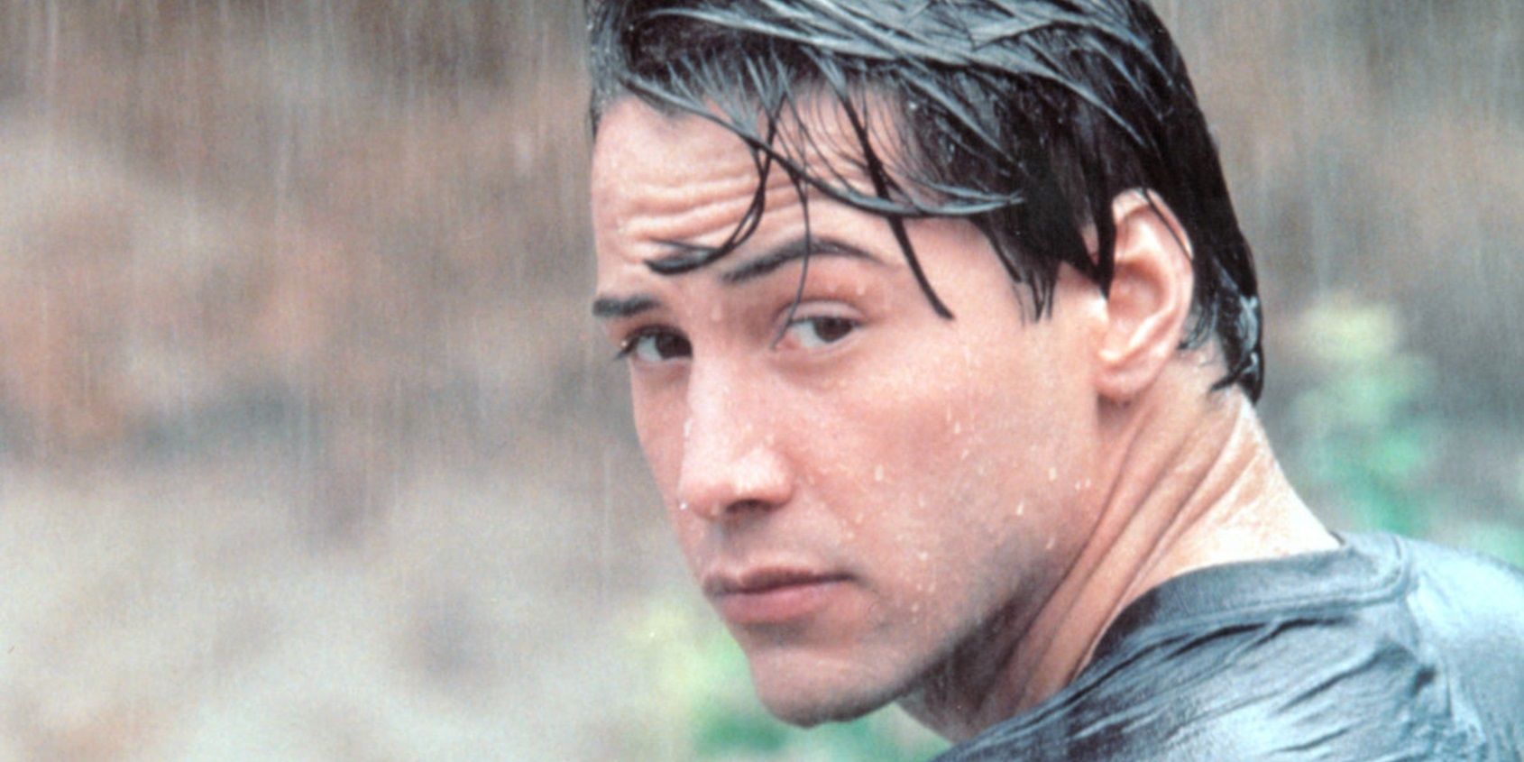 Johnny Utah (Keanu Reeves) in the rain in Point Break