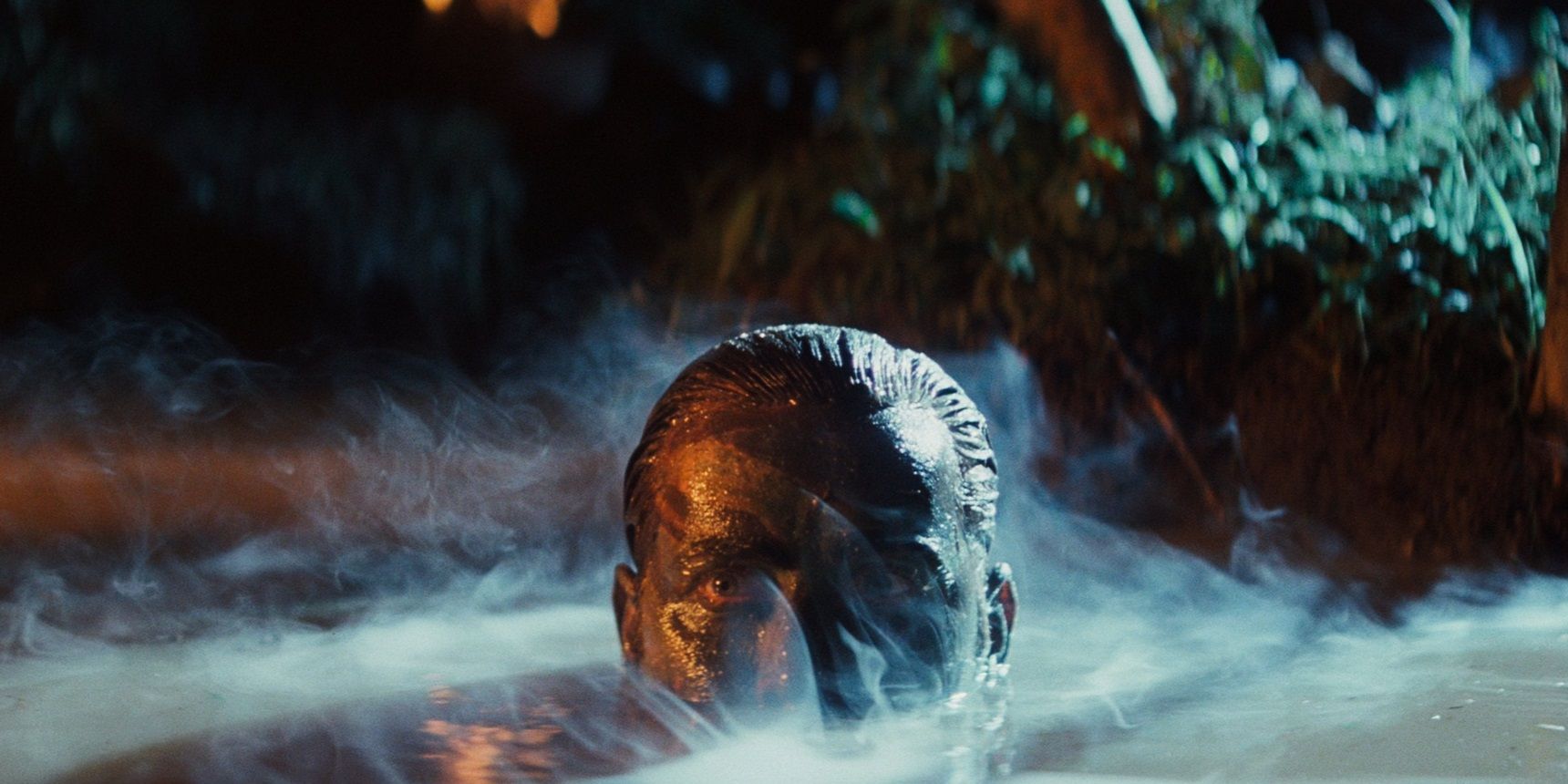 Martin Sheen as Benjamin Willard in a river in Apocalypse Now.