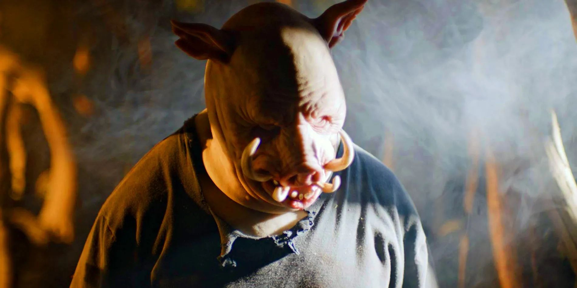 Chris Cordell as Piglet amid smoke and dramatic lighting in Winnie-the-Pooh: Blood and Honey