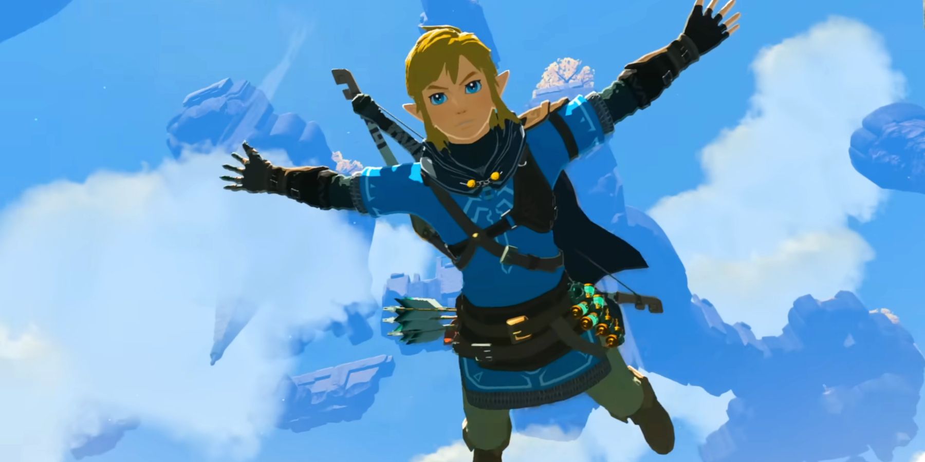 Link skydiving from a floating island in a Tears of the Kingdom trailer. His arms and legs are outspread, with the camera below Link, looking up at him with clouds and more floating islands in the sky behind.