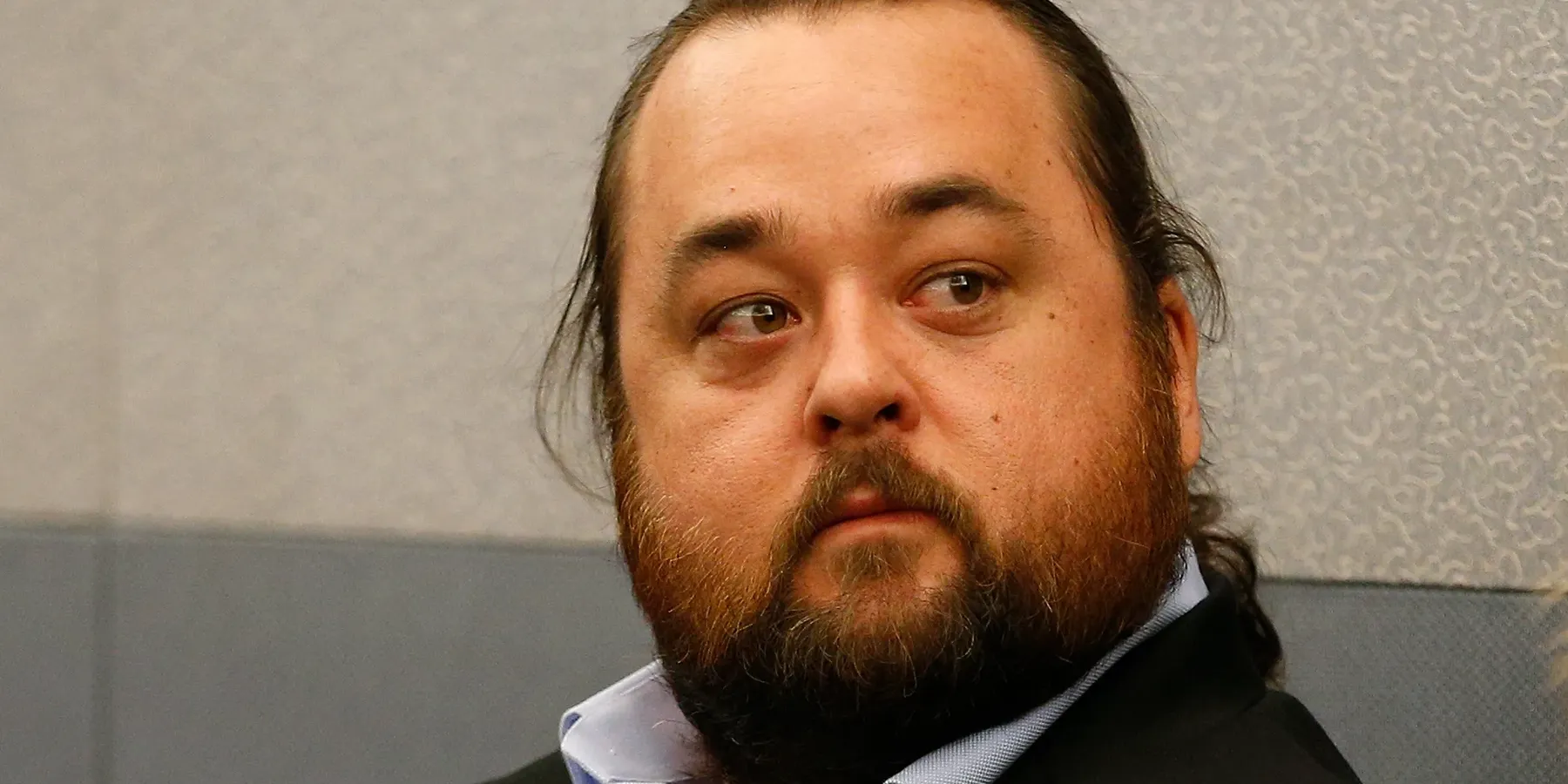 Austin Lee Russell Chumlee pawn stars wearing white shirt looking serious