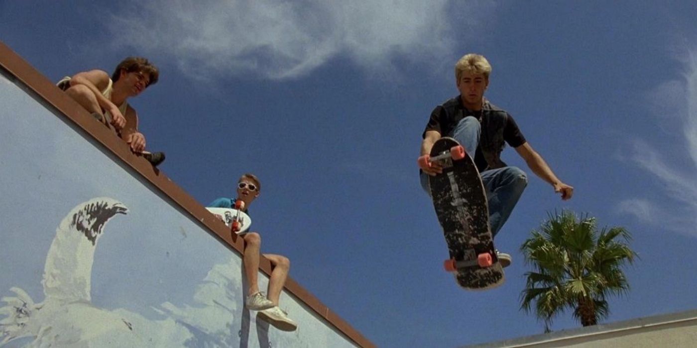 A character doing a stunt while two others watch in Thrashin