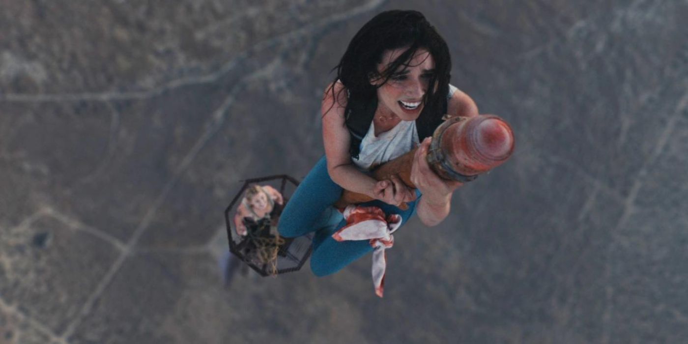 A woman clinging onto a tower in Fall