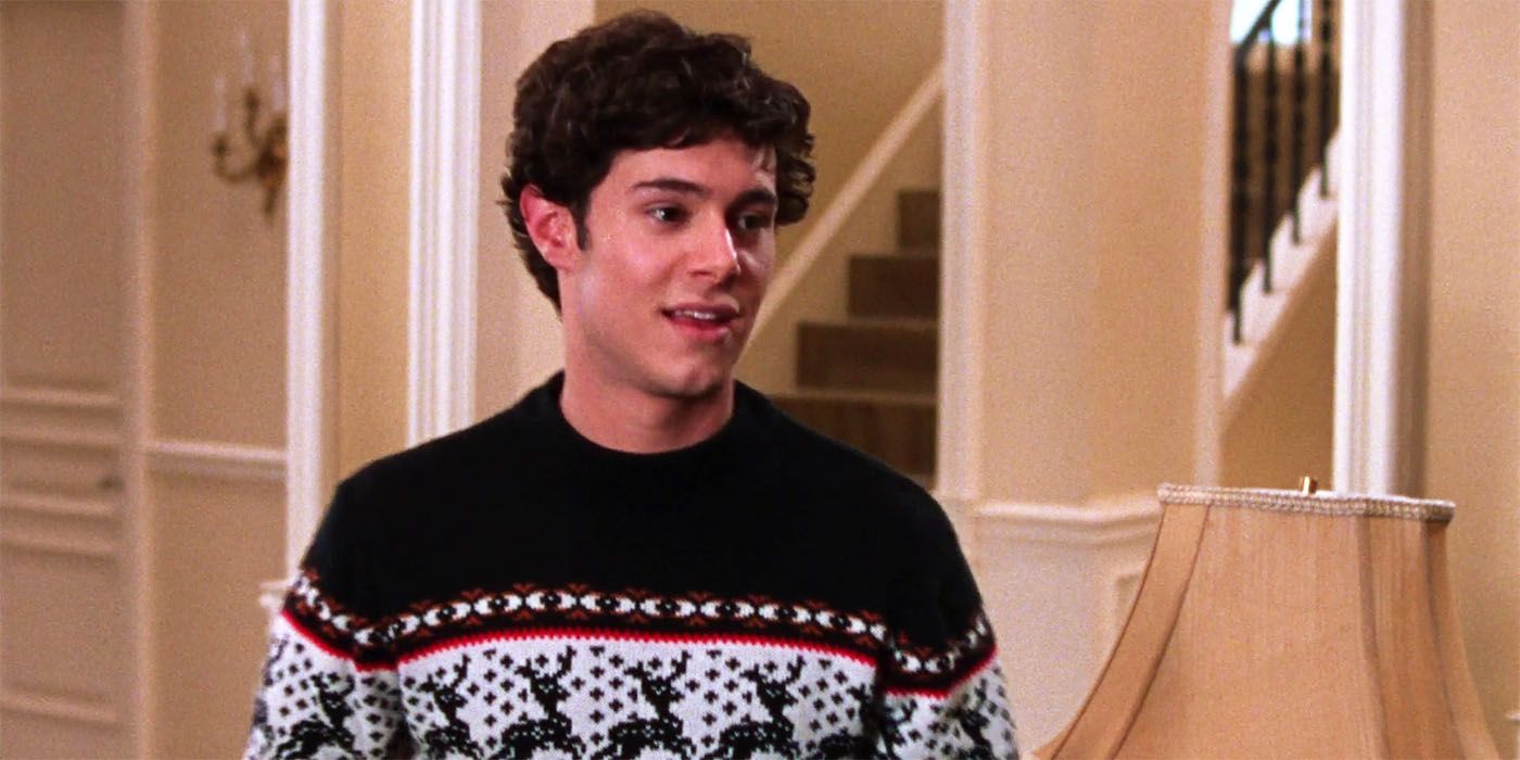 Adam Brody wearing a Christmas sweater in The OC