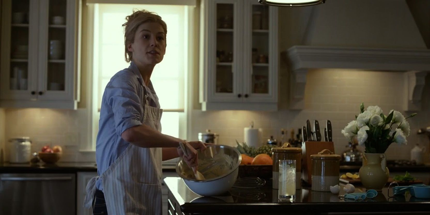 Amy in the kitchen in Gone Girl