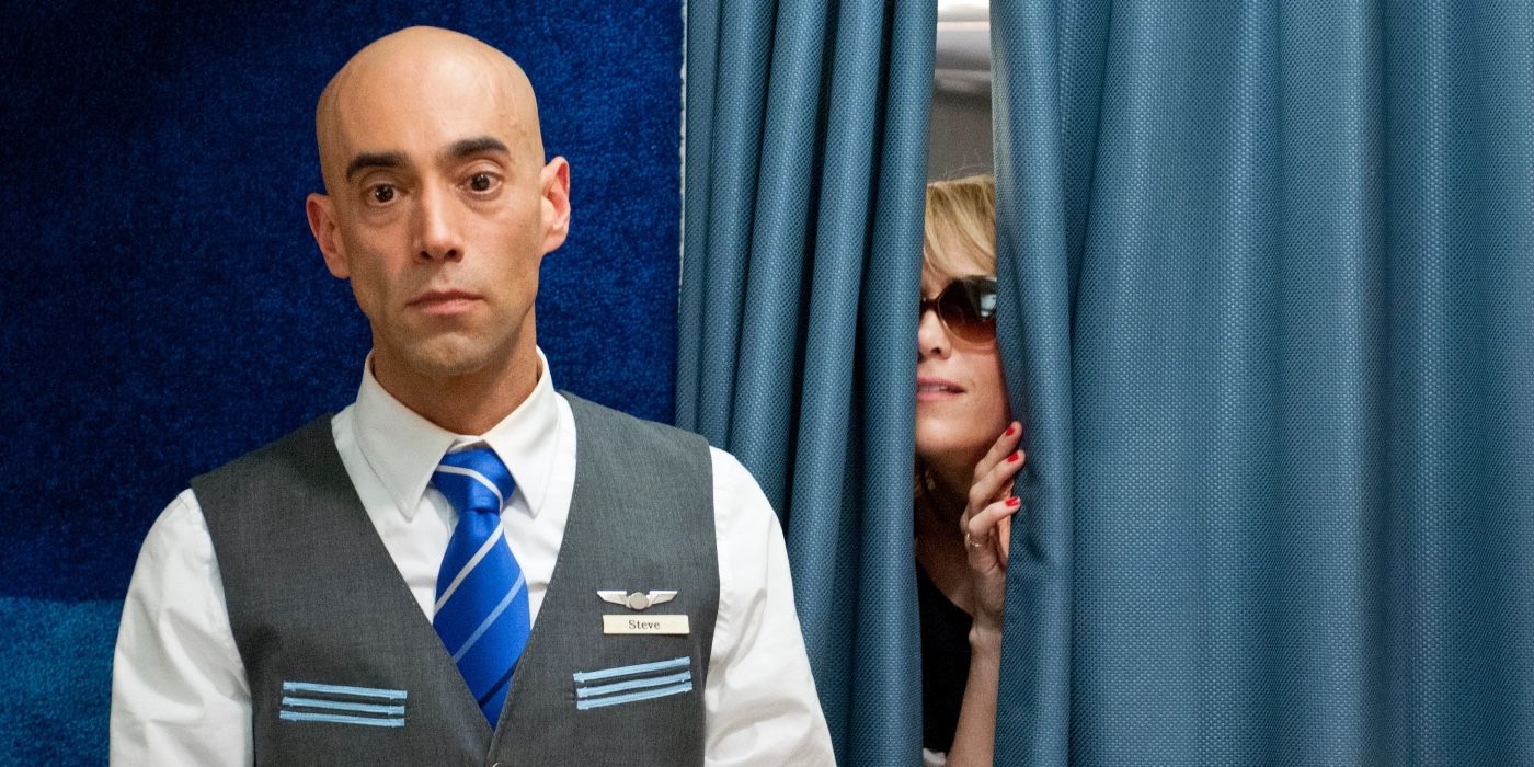 Annie peeking into first class on the flight in Bridesmaids