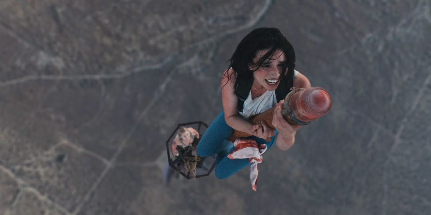 Becky clinging onto the tower in Fall