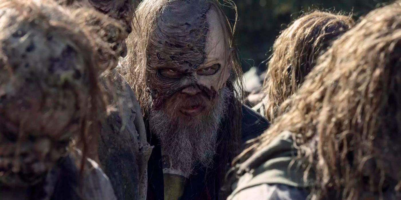 Beta (Ryan Hurst) wearing a mask and looking at something in The Walking Dead 