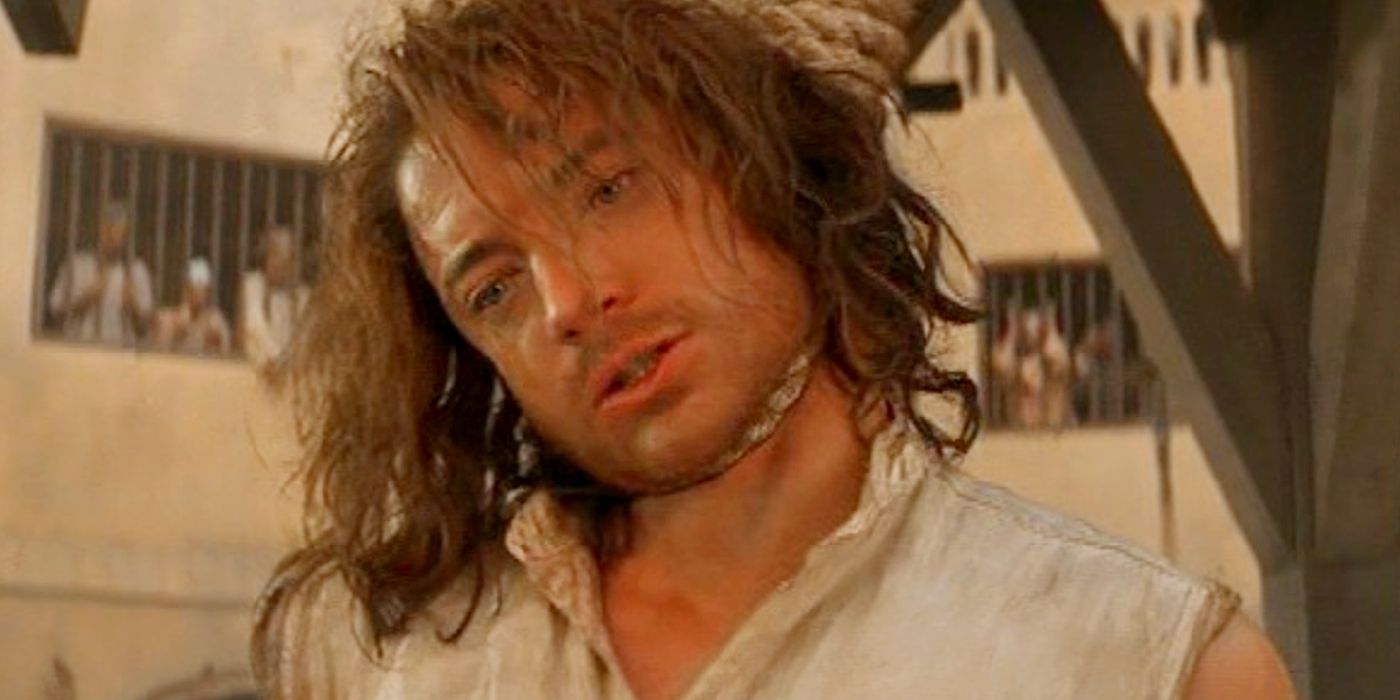 Brendan Fraser as Rick O'Connell with a rope around his neck in The Mummy.