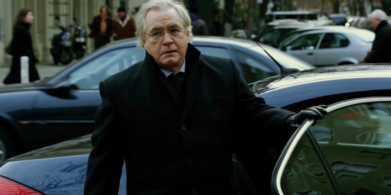 Brian Cox como Ward Abbott nos filmes Bourne