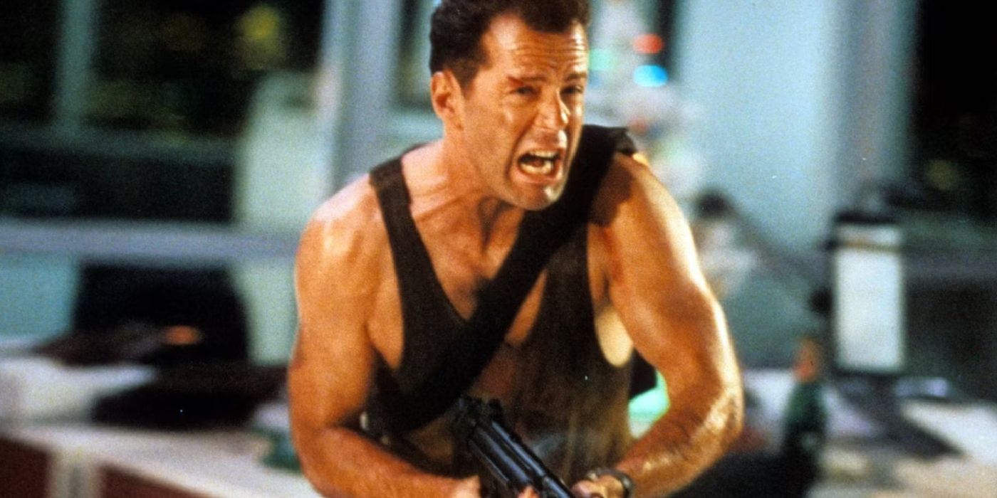 Bruce Willis grita mientras sostiene un arma en Die Hard.