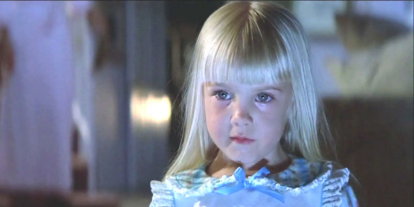 Little girl in the movie Poltergeist staring mesmerized with blush TV light shining on her face.