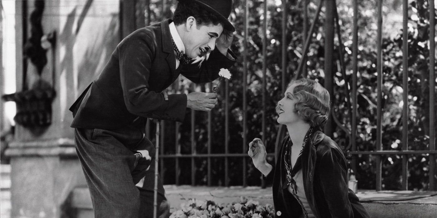 Charlie Chaplin's The Tramp greets a young woman in City Lights 