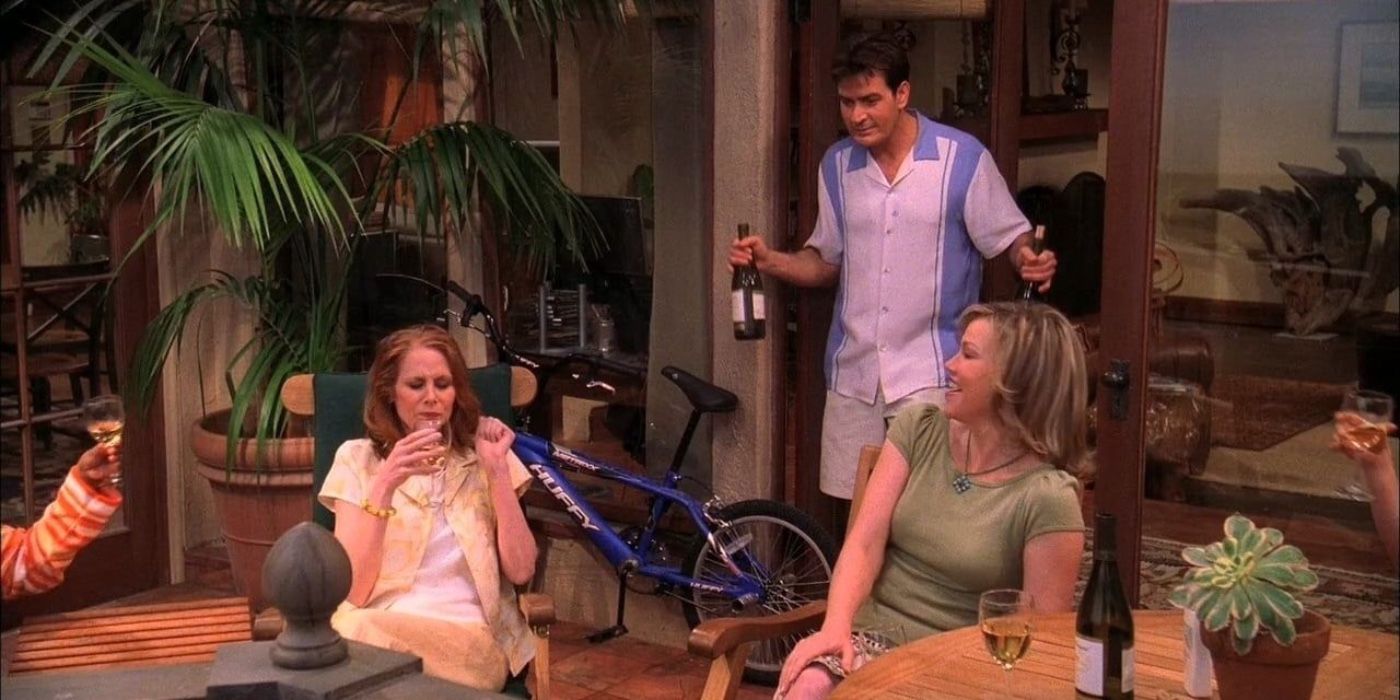 Charlie holding wine in Two and a Half Men