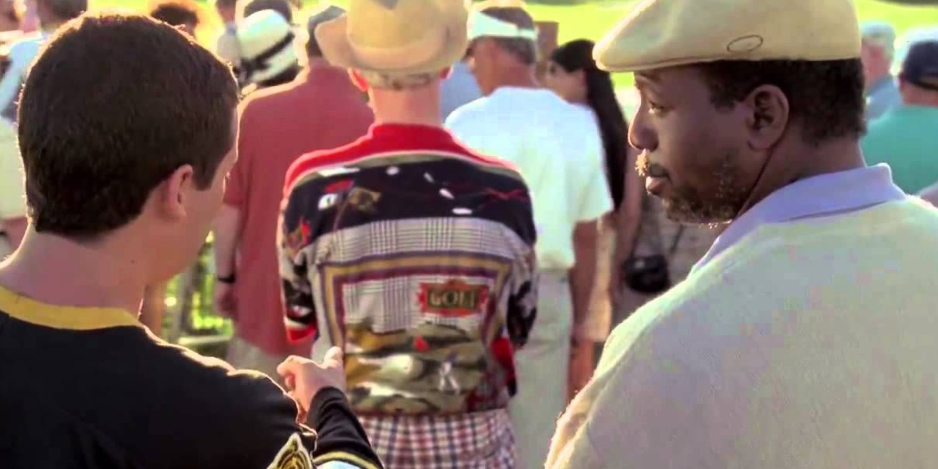 Chubbs looking at Happy as he points at golfing clothes in Happy Gilmore