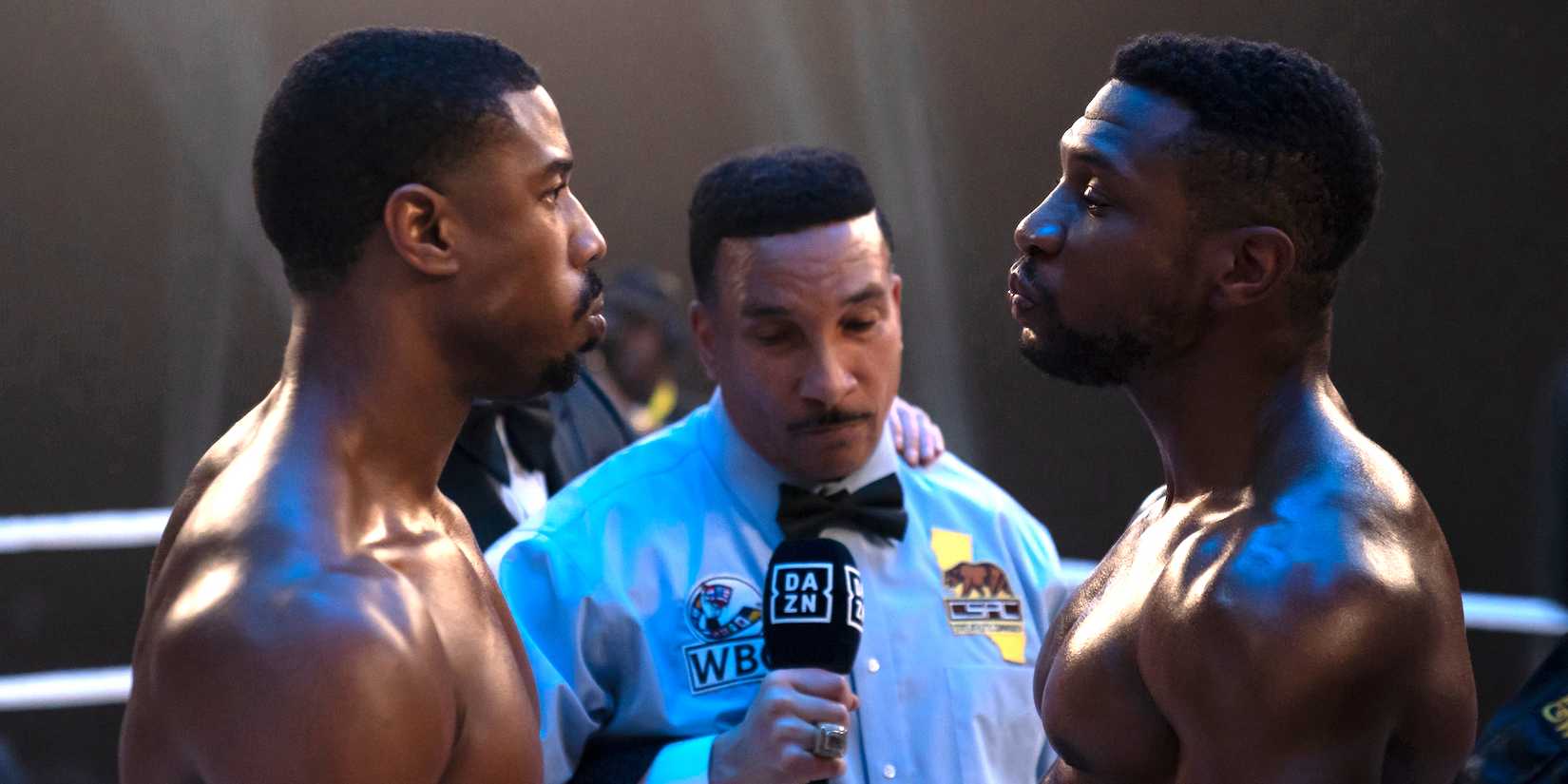 Michael B. Jordan as Adonis "Donnie" Creed facing Jonathan Majors as Damian "Diamond Dame" Anderson in Creed III.