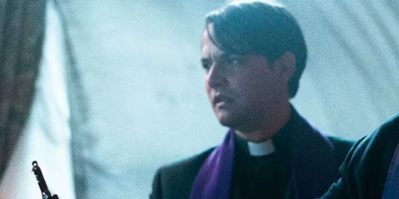 Daniel Zovatto in priest garb looking sideways in The Pope's Exorcist 