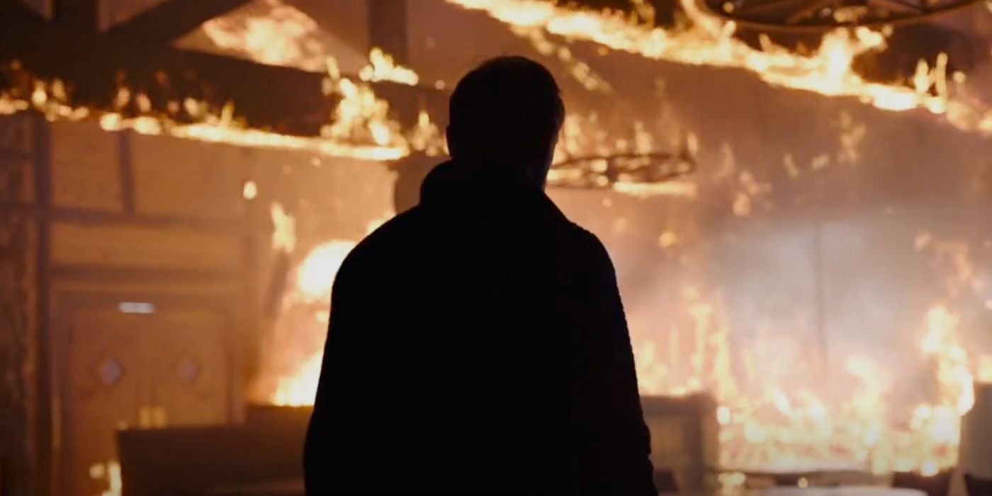 David standing amid the flames of the burning Todd's Steakhouse in Last of Us episode 8