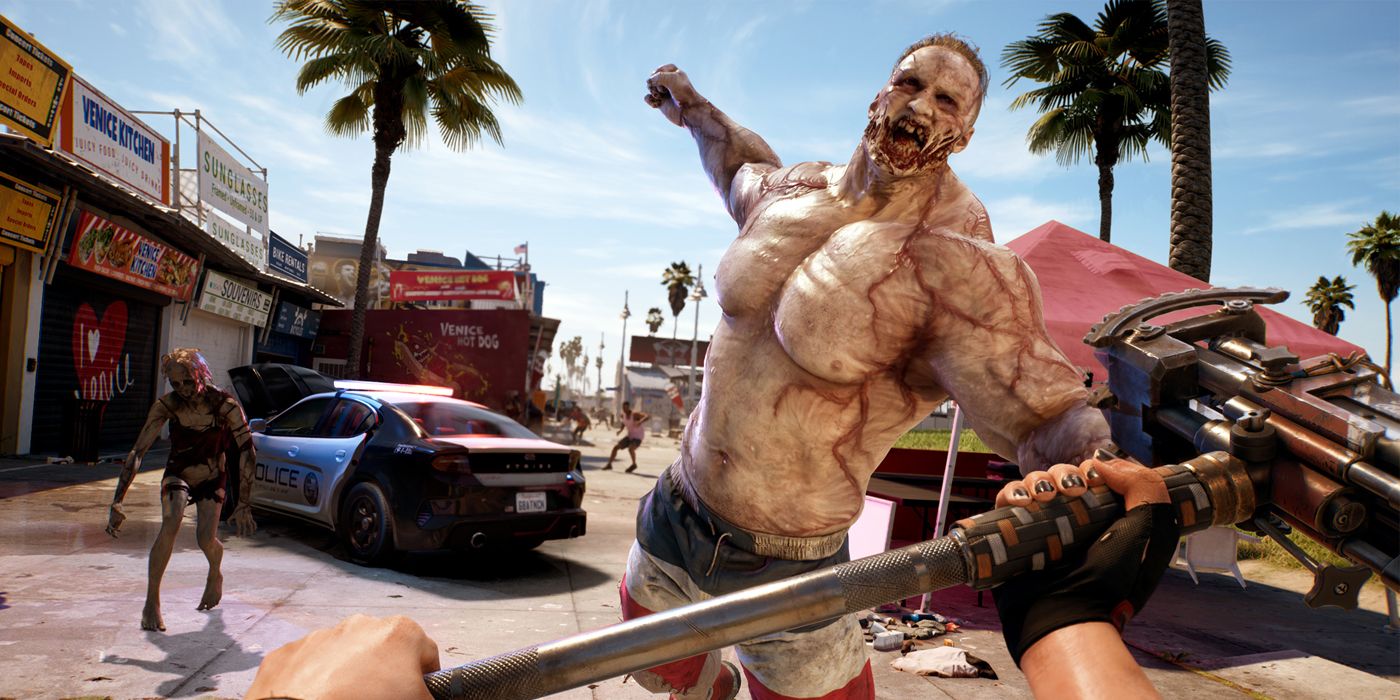 A first-person perspective of a muscular "Thug" zombie attacking a sledgehammer-wielding player on a zombie-infested Venice Beach in Dead Island 2.