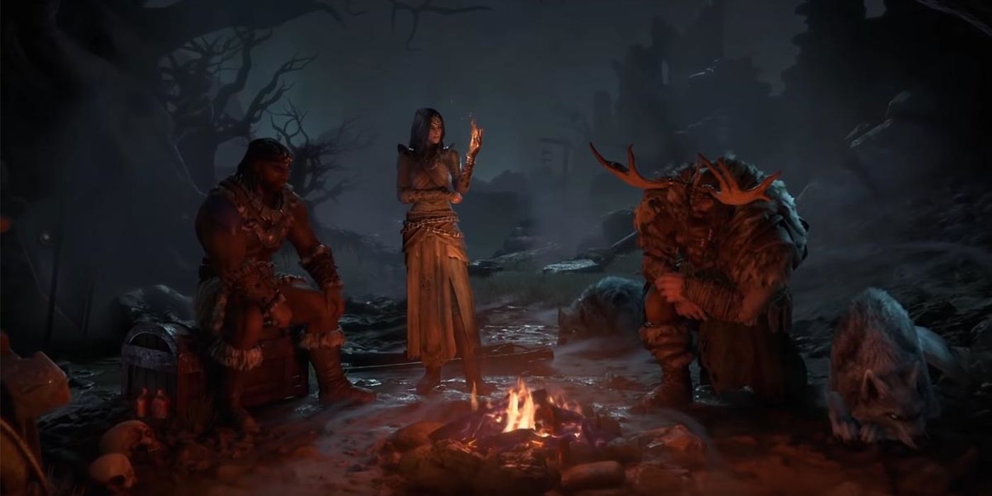Three characters in Diablo 4 are at camp staring into a campfire