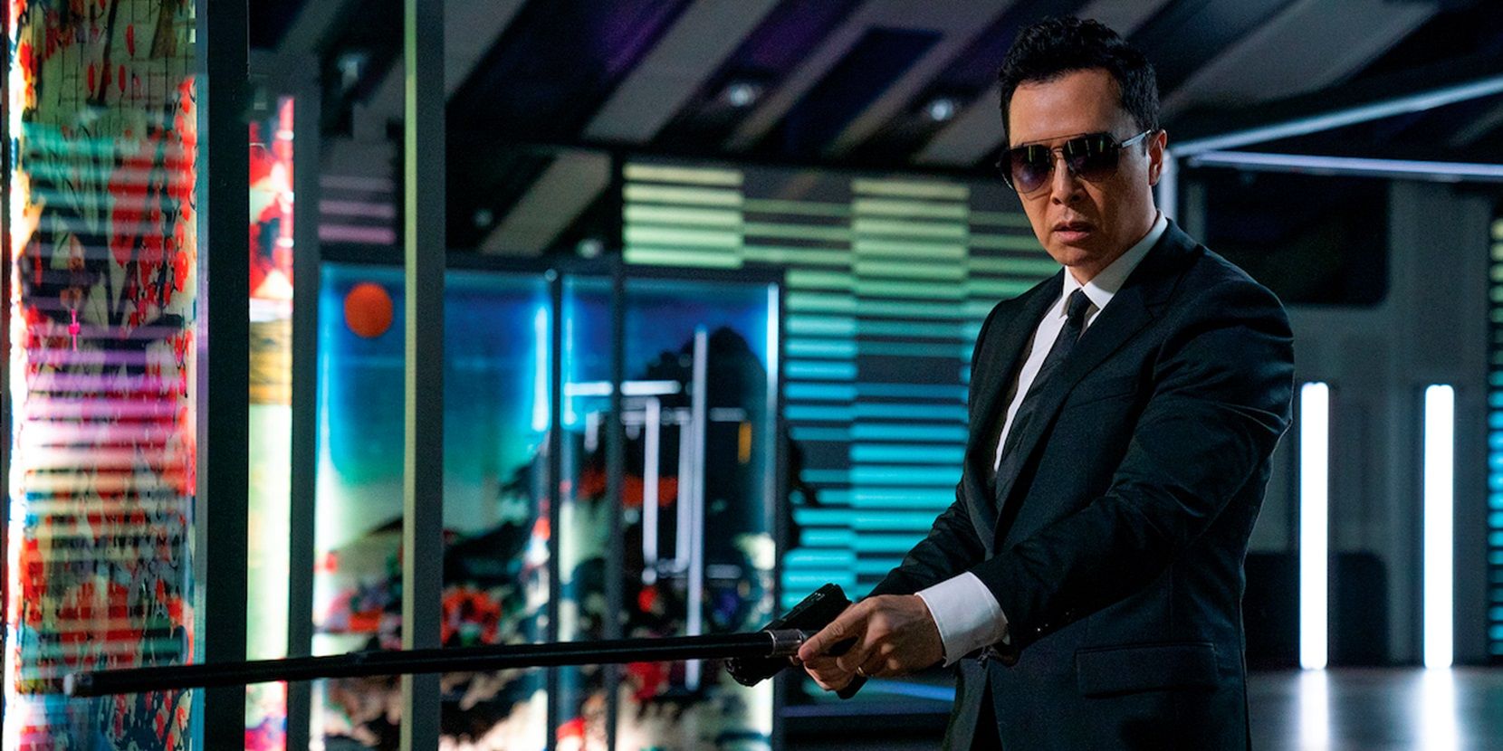 Donnie Yen with a gun in John Wick Chapter 4