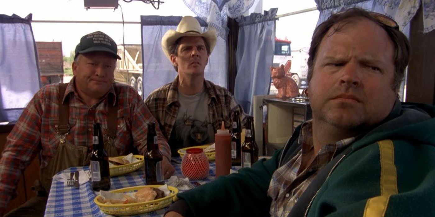 Sea Bass' (Cam Neely) friends sitting at a diner table Dumb & Dumber.