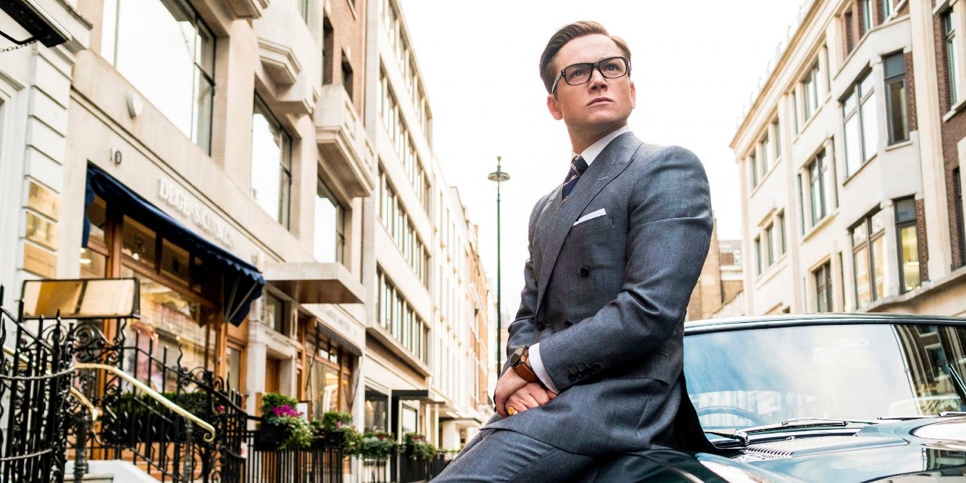 Eggsy sitting on a car in Kingsman The Golden Circle