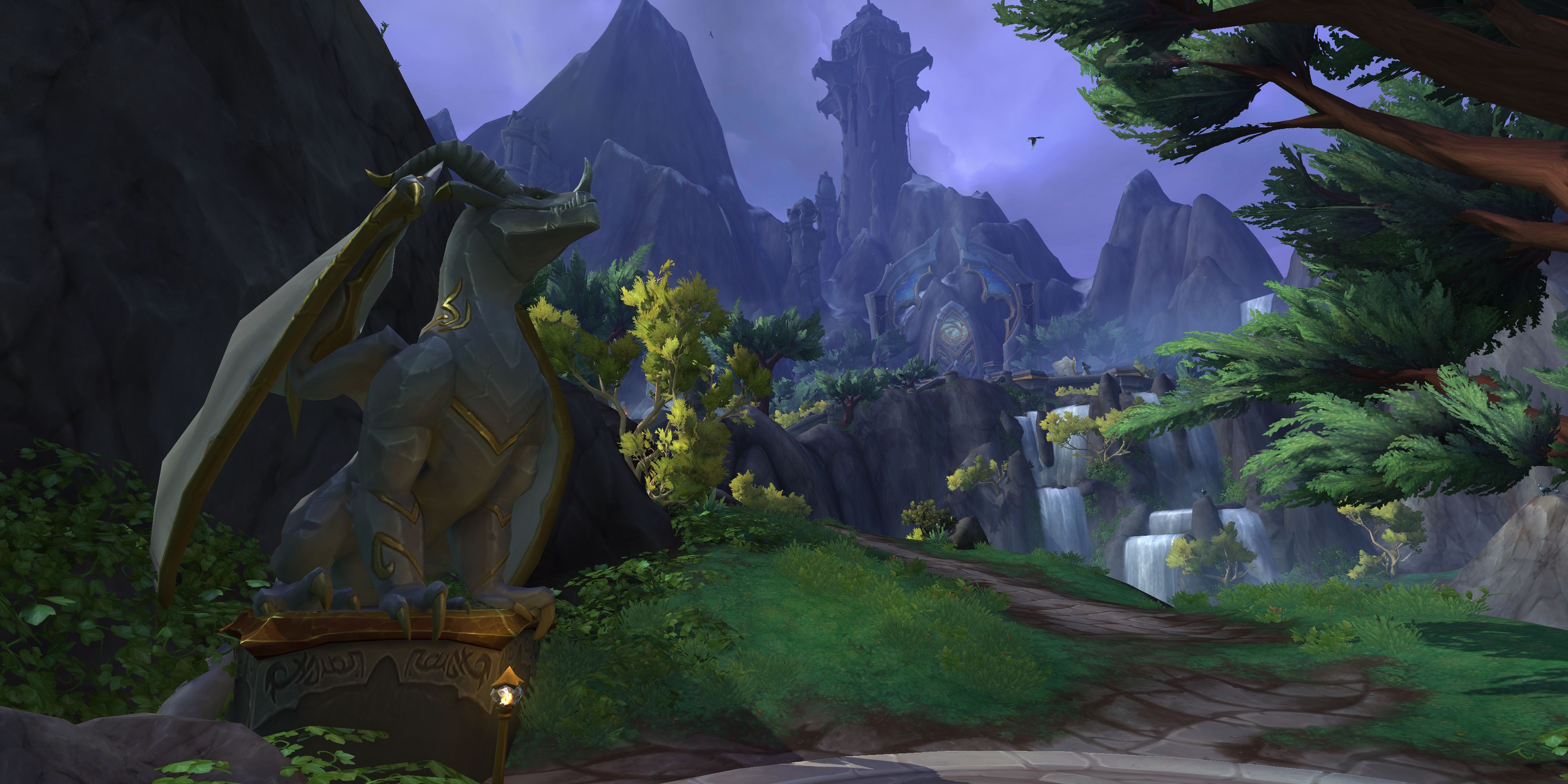 Forbidden Reach in World of Warcraft, with a majestic statue of a dragon to the left side of a stone pathway that leads around the side of a cliff, buildings and waterfalls in the distance