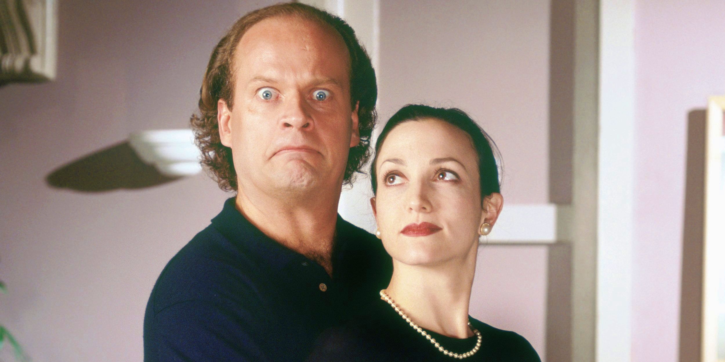 Frasier making a funny face while holding Lilith