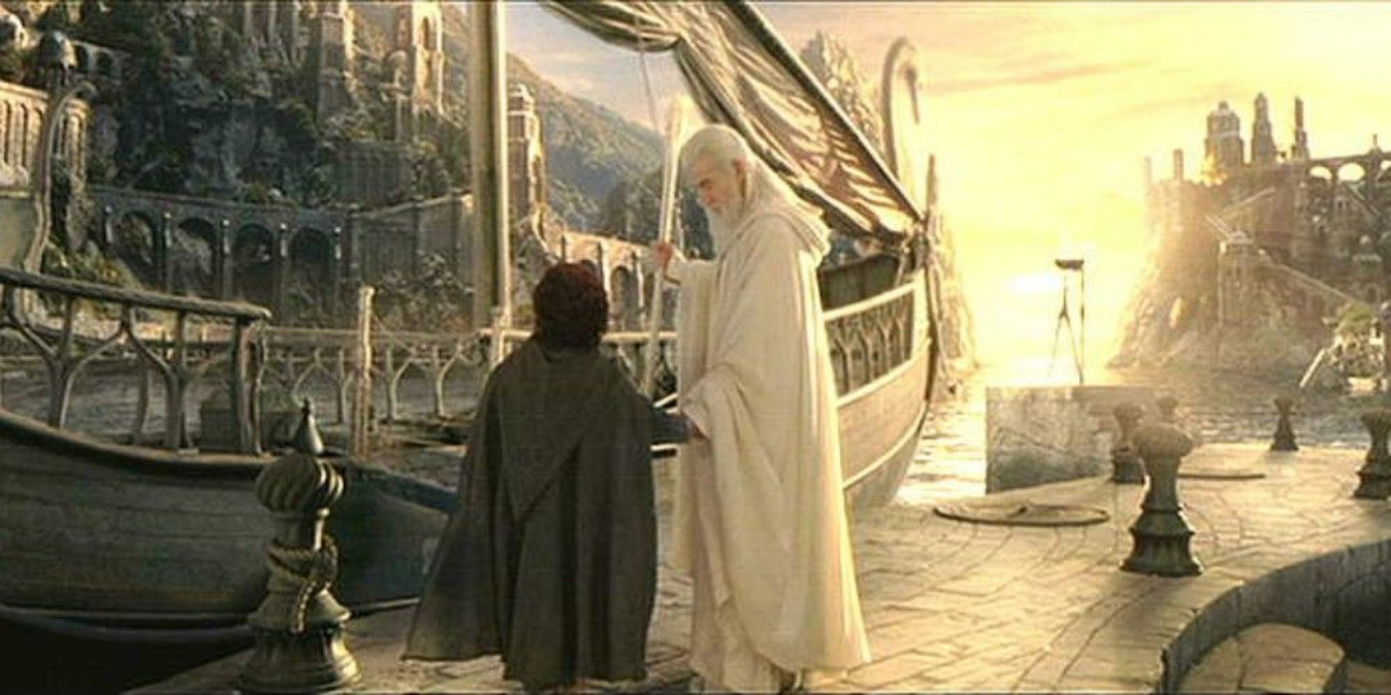 Gandalf (Ian McKellan) helps Frodo (Elijah Wood) onto a boat in the Grey Havens. 