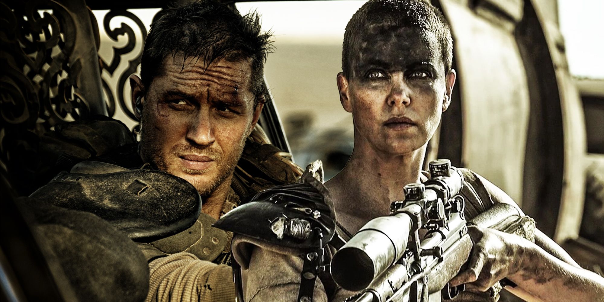 Max (Tom Hardy) and Imperator Furiosa (Charlize Theron) sitting in a car while Furiosa holds a rifle in Mad Max: Fury Road.