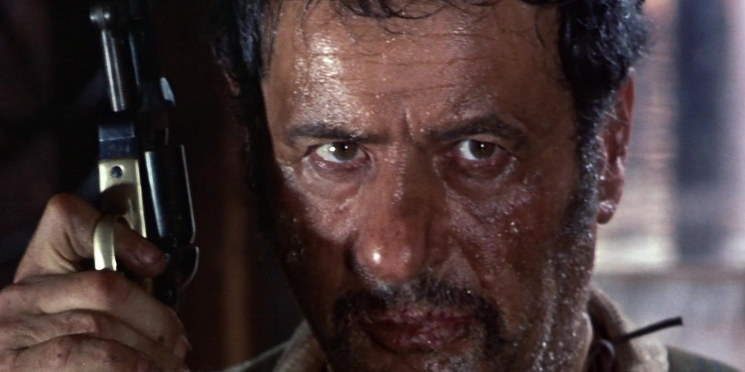 A very sweaty Tuco (Eli Wallach) holds a gun in The Good, the Bad and the Ugly