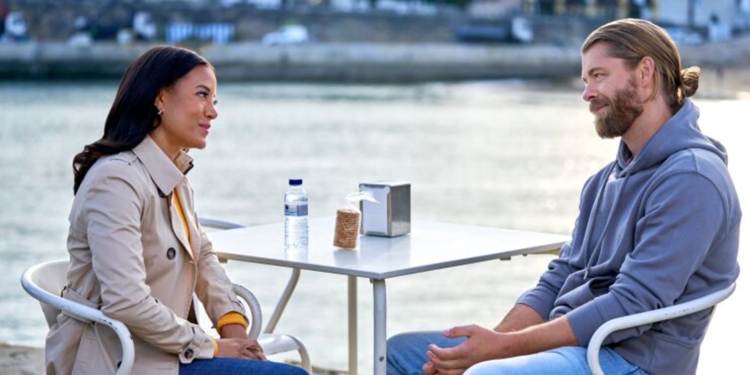 Heather Hemmens and Luke Mitchell sitting at a table in A Pinch Of Portugal