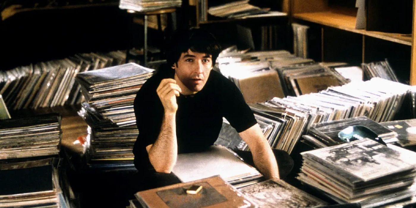 Rob sits among his records in High Fidelity 