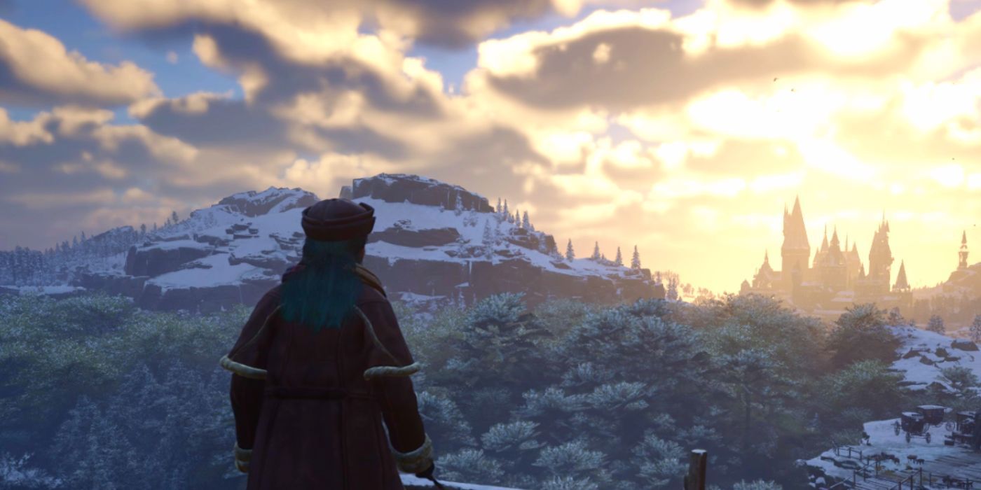 A female Hogwarts Legacy student looking out onto a snowy sunrise over Hogwarts in the distance.