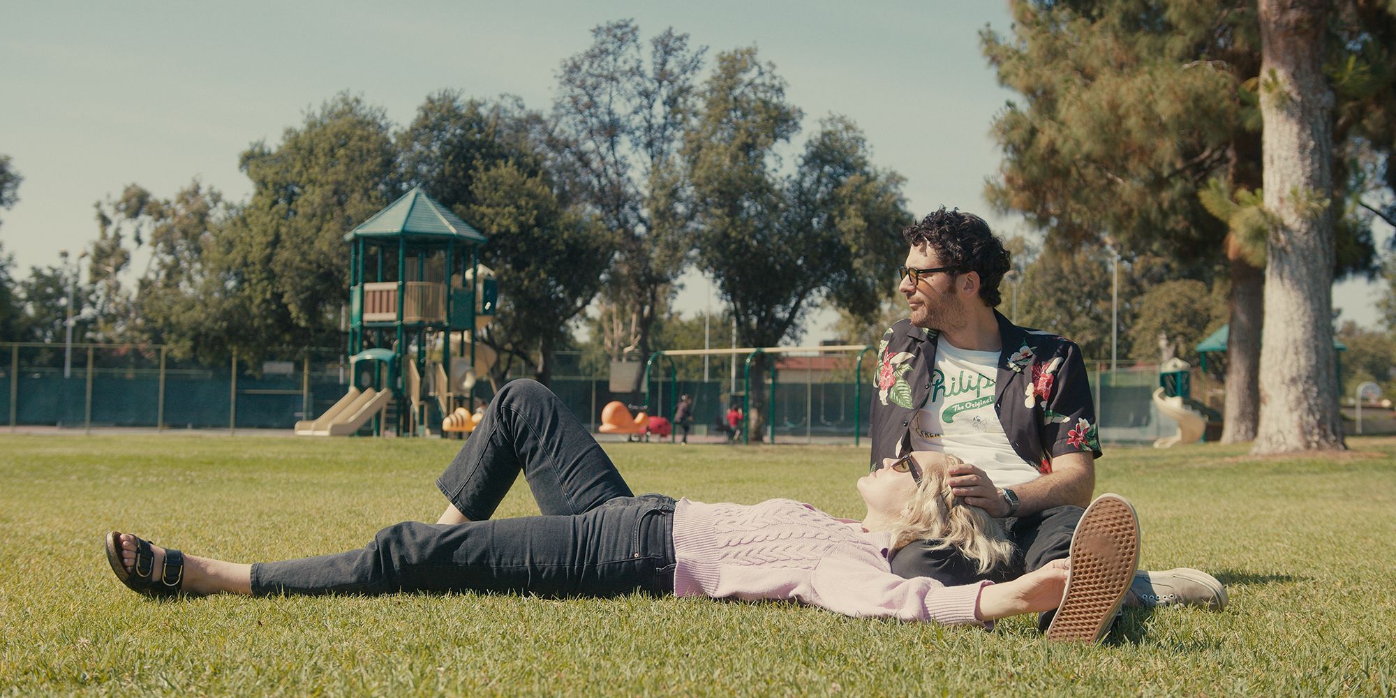 Hope Lauren & Daniel laying outside in Pure O