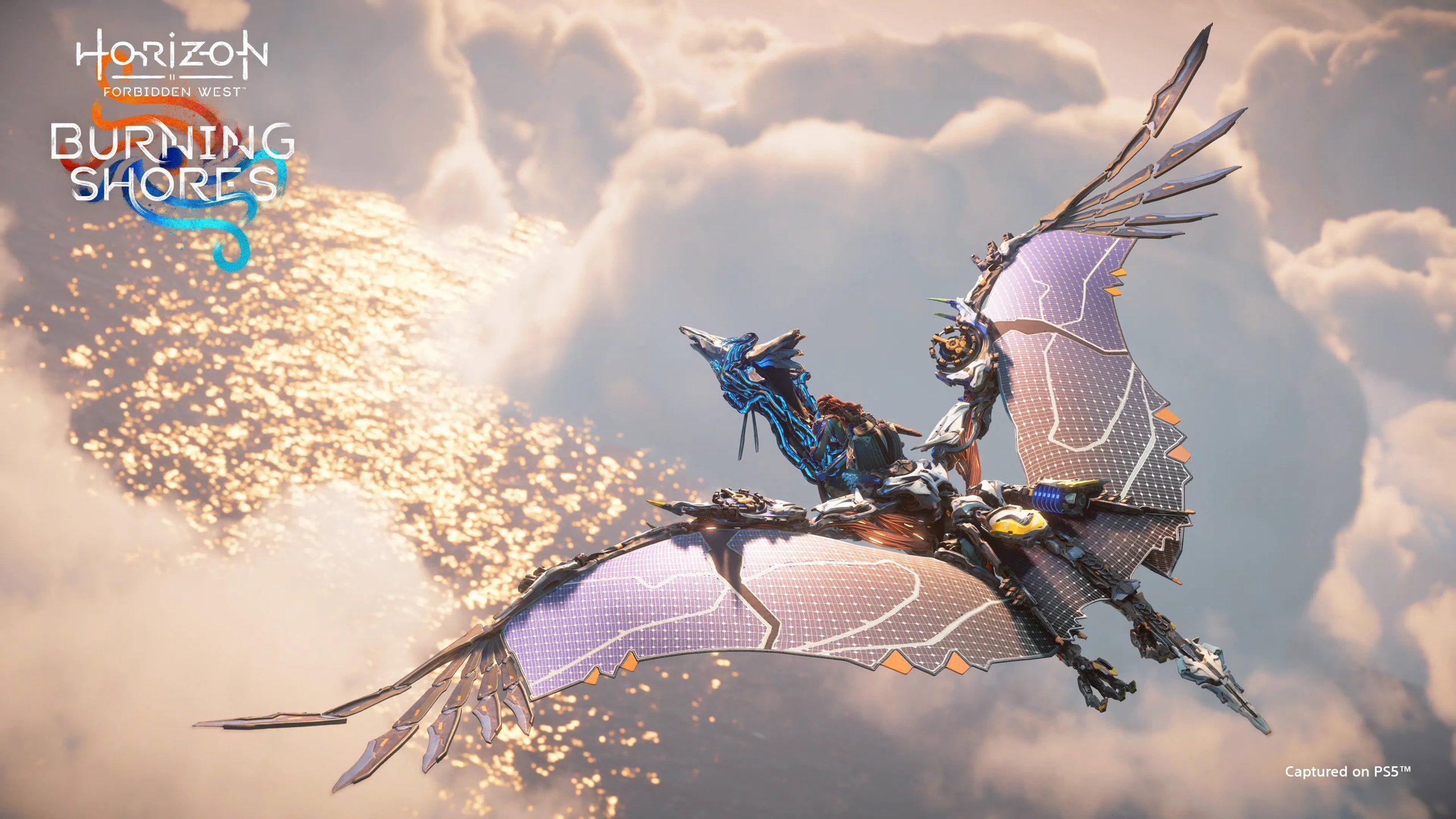 An aerial shot of Aloy on the back of a Sunwing, flying among the clouds in Horizon Forbidden West: Burning Shores.