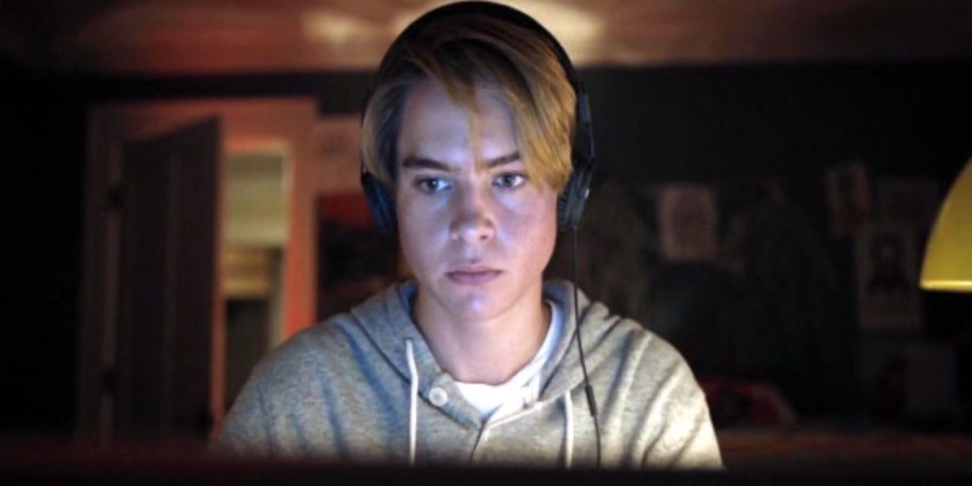 Conner Harper looks at his computer in I See You