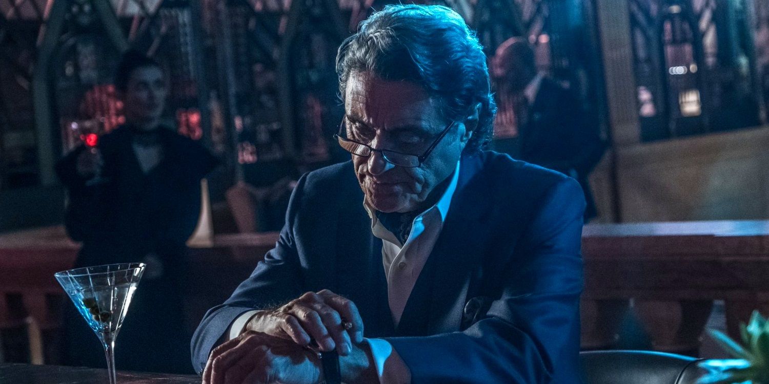 Ian McShane with a martini glass in John Wick Chapter 4