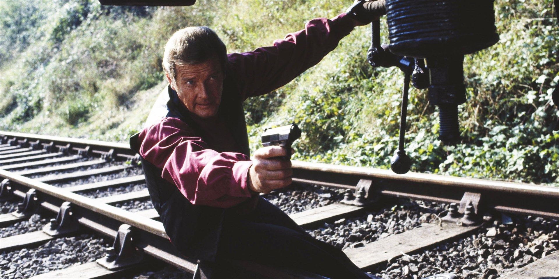 Roger Moore on train tracks in Octopussy
