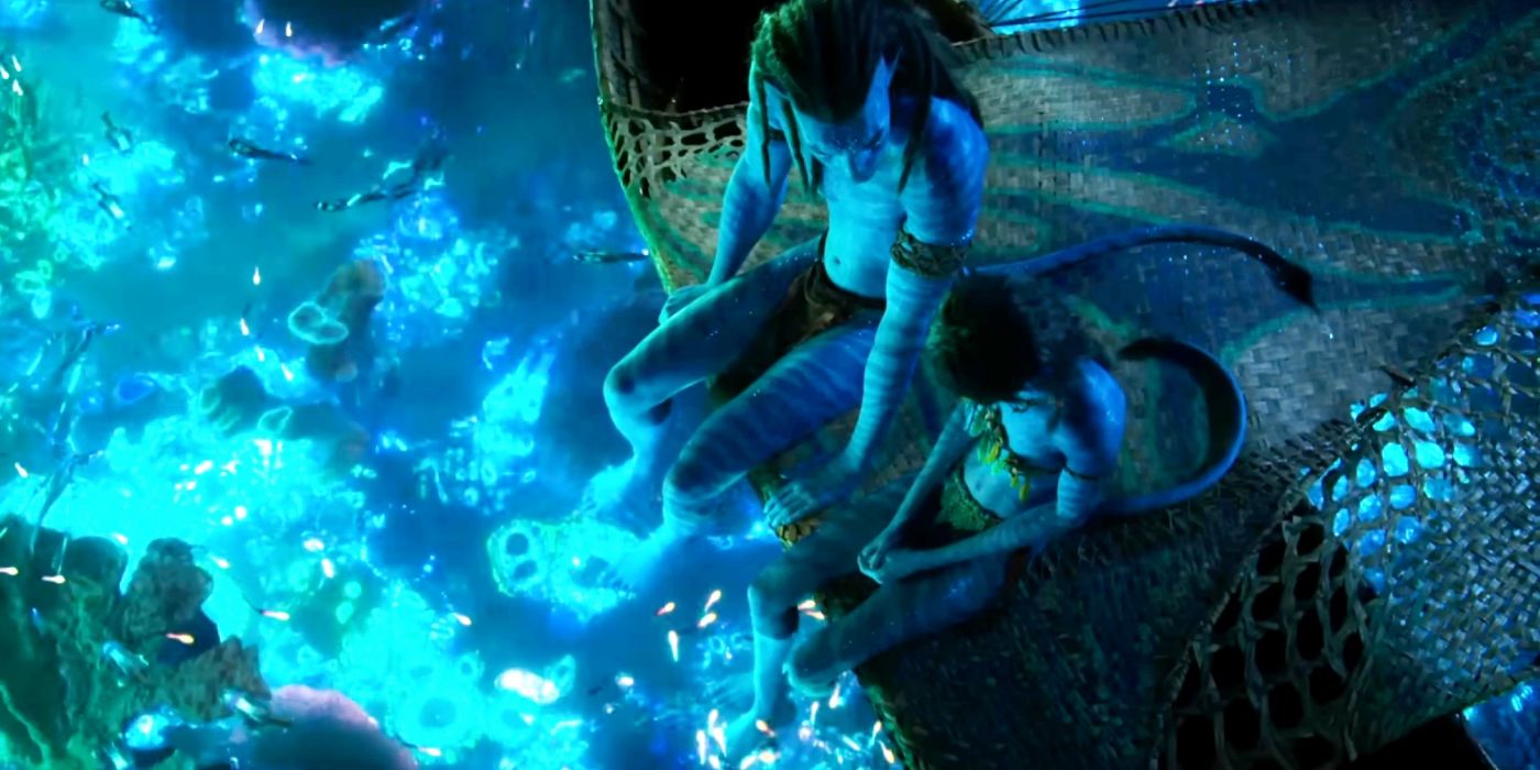 Jake Sully and his child by the well-lit water in Avatar 2