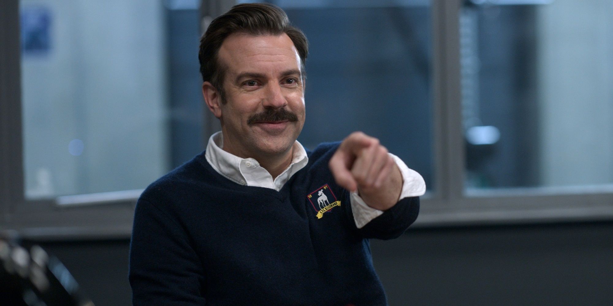 Jason Sudeikis pointing in Ted Lasso