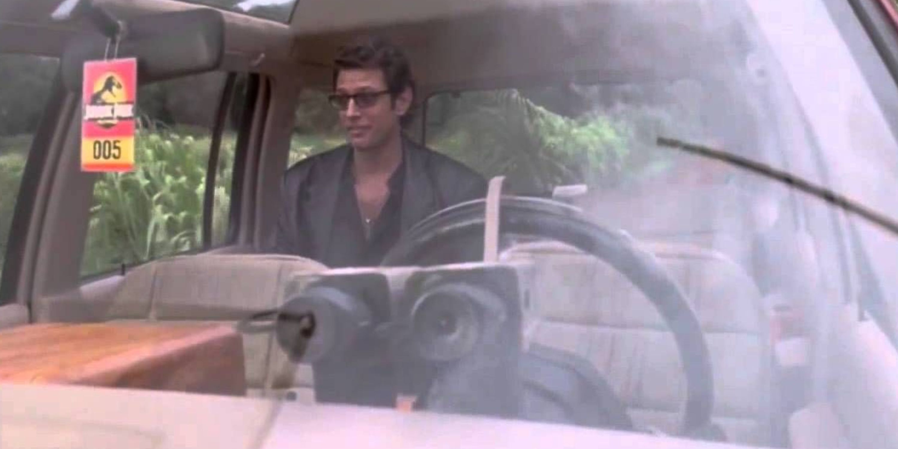 Jeff Goldblum alone in the car in Jurassic Park
