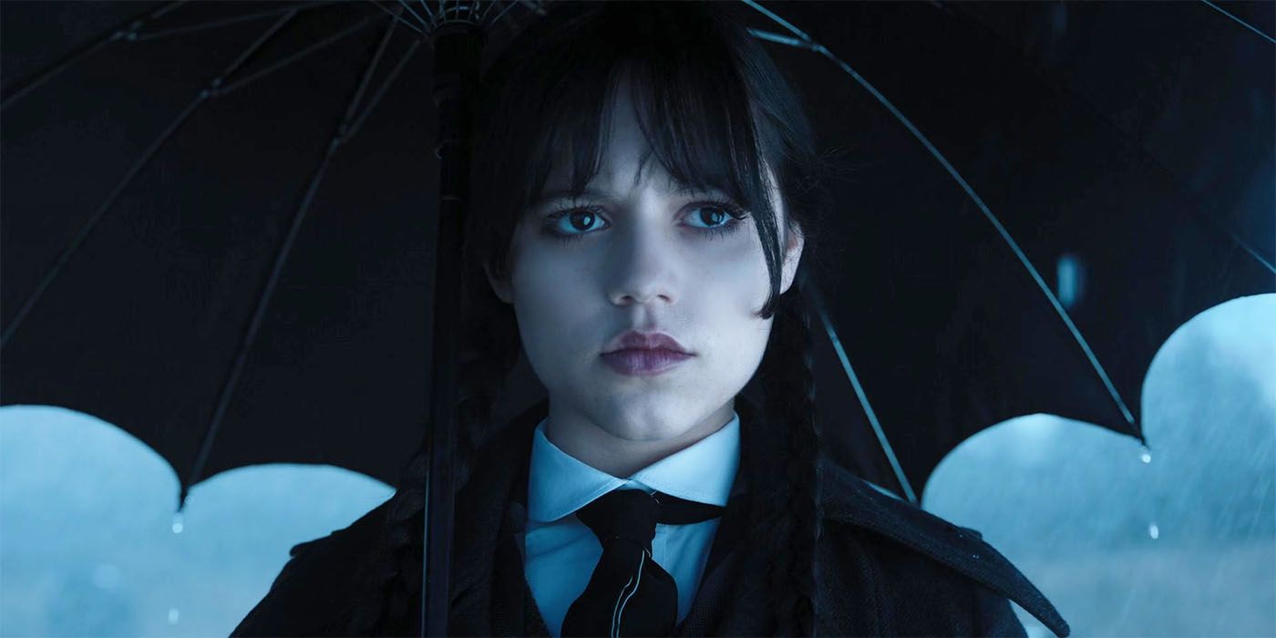 Jenna Ortega as Wednesday holding an umbrella in episode 7