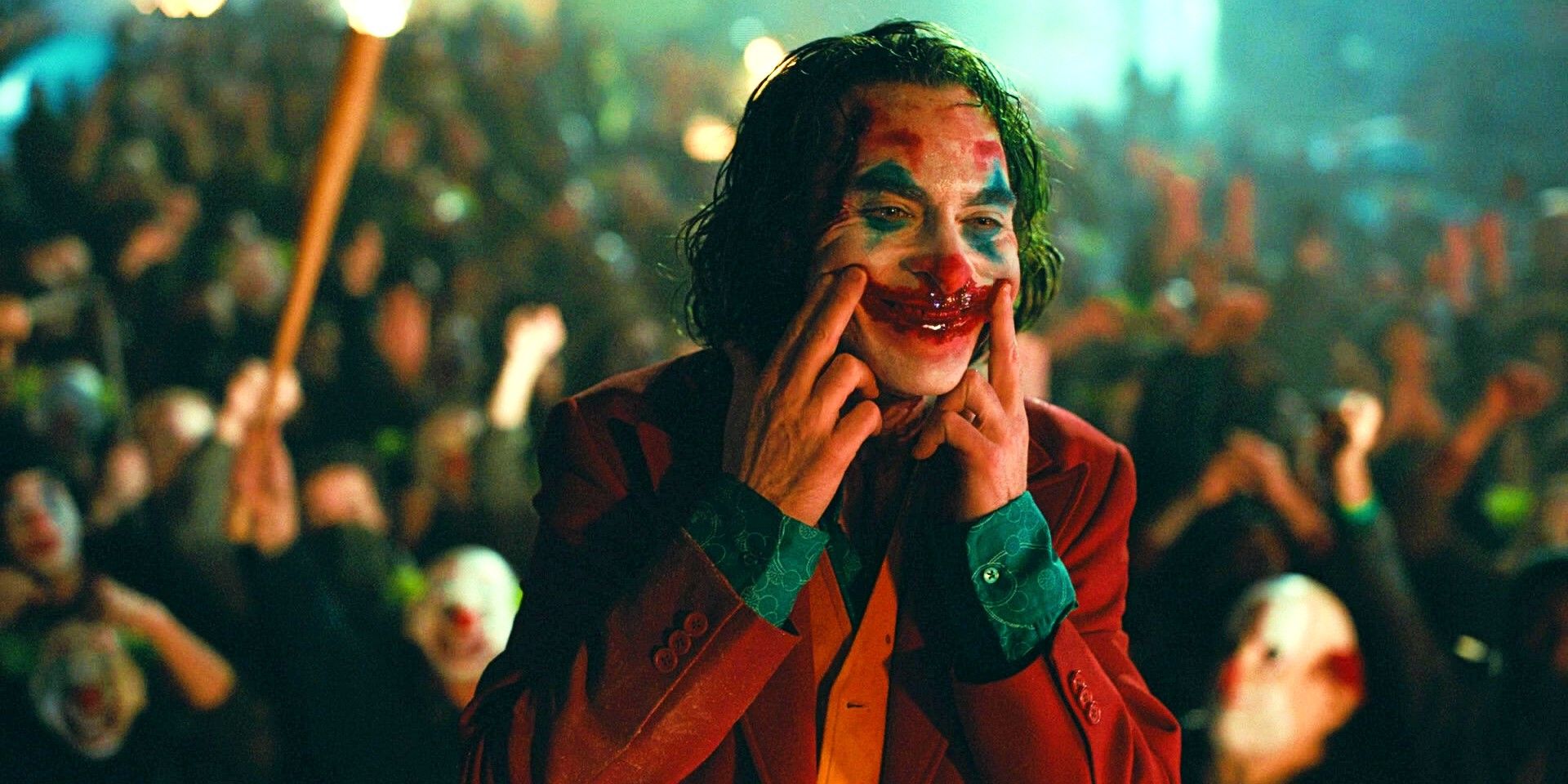 Joaquin Phoenix as Arthur Fleck in Joker Makeup Forces A Smile In Joker Movie